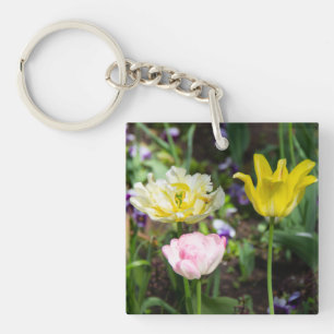 White, pink and yellow tulips in the garden keychain