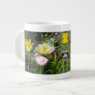 White, pink and yellow tulips in the garden large coffee mug