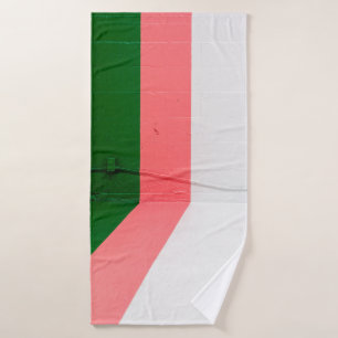 White, pink, green, and yellow painted wall bath towel