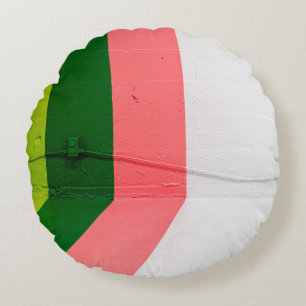 White, pink, green, and yellow painted wall round pillow