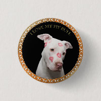 White pitbull with red kisses all over his face.