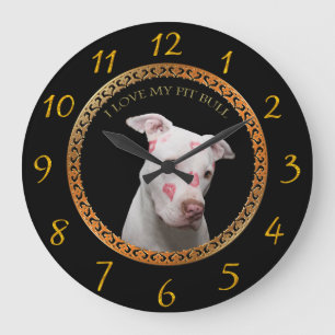 White pitbull with red kisses all over his face.   large clock