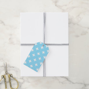 White polka crosses on baby blue gift tags