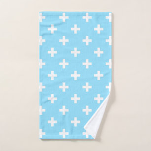 White polka crosses on baby blue hand towel