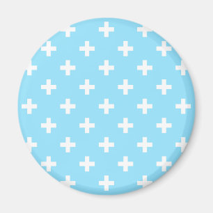 White polka crosses on baby blue magnet