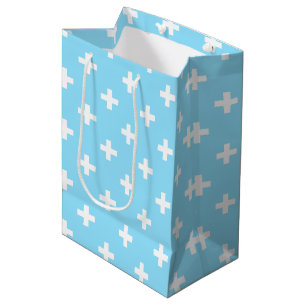 White polka crosses on baby blue medium gift bag