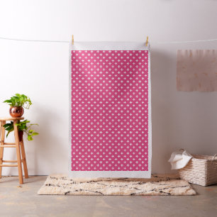 White polka crosses on fuchsia fabric