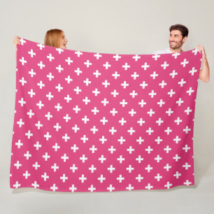 White polka crosses on fuchsia fleece blanket