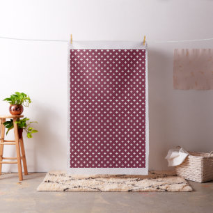 White polka crosses on mulberry fabric