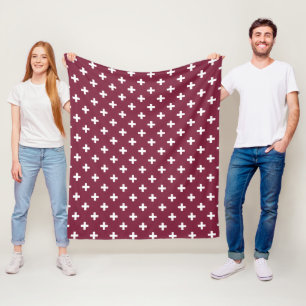 White polka crosses on mulberry fleece blanket