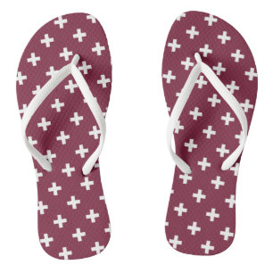 White polka crosses on mulberry flip flops