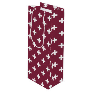 White polka crosses on mulberry wine gift bag
