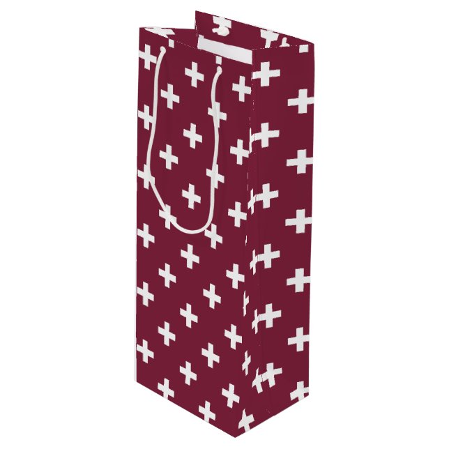 White polka crosses on mulberry wine gift bag (Front Angled)