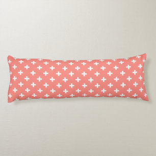 White polka crosses on peach body pillow