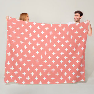 White polka crosses on peach fleece blanket