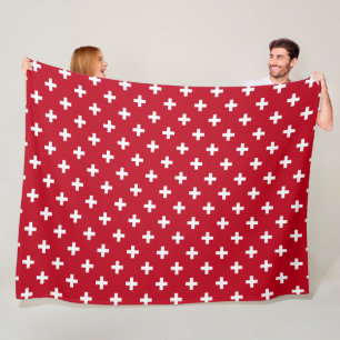 White polka crosses on red fleece blanket