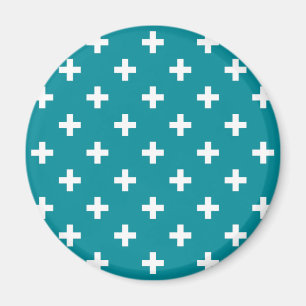 White polka crosses on teal magnet