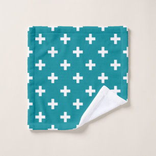 White polka crosses on teal wash cloth
