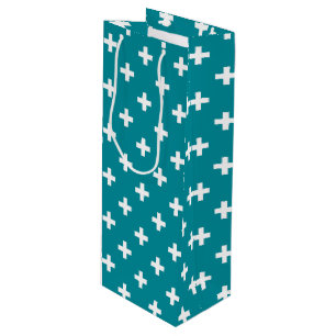 White polka crosses on teal wine gift bag