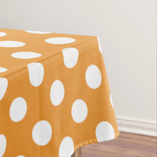 White polka dots on amber tablecloth