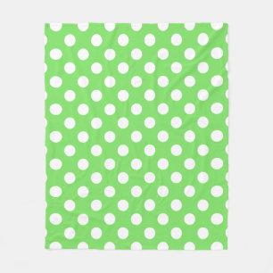 White polka dots on apple green fleece blanket