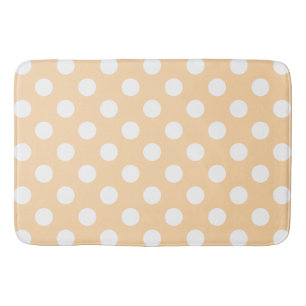 White polka dots on beige bath mat