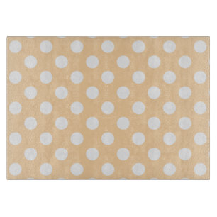 White polka dots on beige cutting board