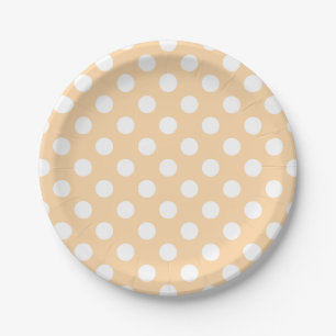 White polka dots on beige paper plate