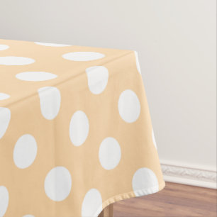 White polka dots on beige tablecloth