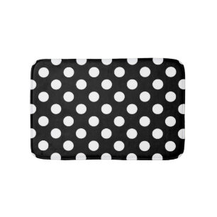 White polka dots on black bath mat