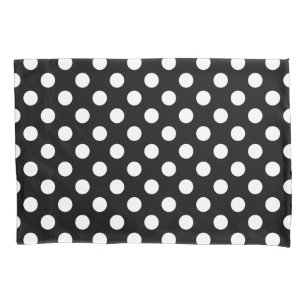 White polka dots on black pillowcase