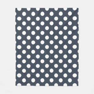 White polka dots on blue-grey fleece blanket