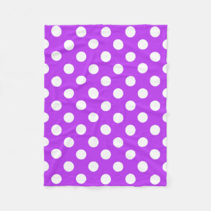 White polka dots on bright purple fleece blanket