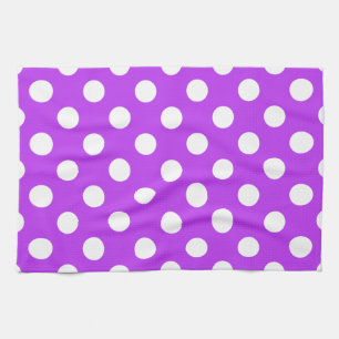 White polka dots on bright purple kitchen towel