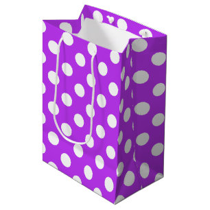White polka dots on bright purple medium gift bag