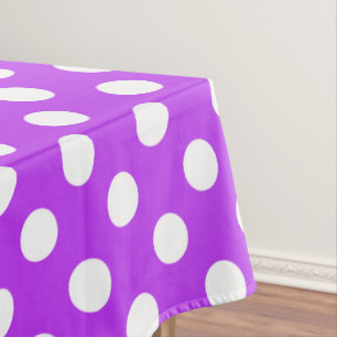 White polka dots on bright purple tablecloth
