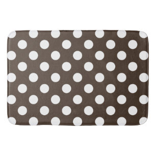 White polka dots on brown bath mat