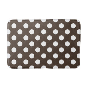 White polka dots on brown bath mat