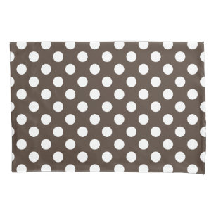 White polka dots on brown pillowcase