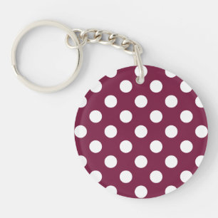 White polka dots on burgundy keychain