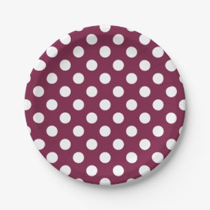 White polka dots on burgundy paper plate