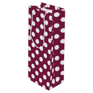 White polka dots on burgundy wine gift bag
