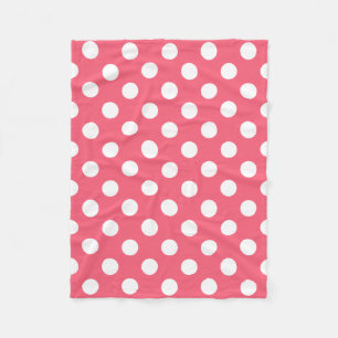 White polka dots on coral fleece blanket