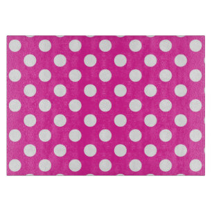 White polka dots on fuchsia cutting board