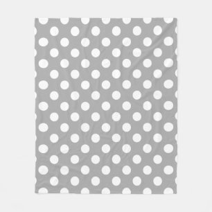 White polka dots on grey fleece blanket
