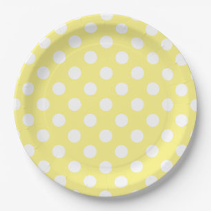 White polka dots on lemon yellow paper plate