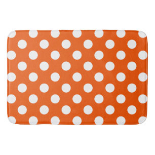 White polka dots on orange bath mat
