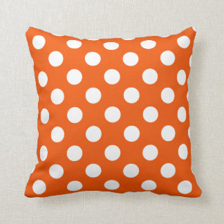 White polka dots on orange throw pillow