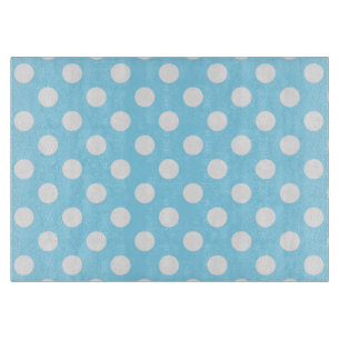 White polka dots on pale blue cutting board