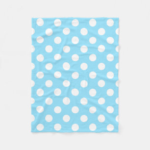White polka dots on pale blue fleece blanket